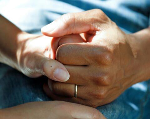 carer holding hands | Stafftax